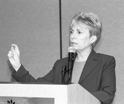 Donna Gerber peaking from podium 
