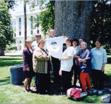 Group of workers infront of the state capital building